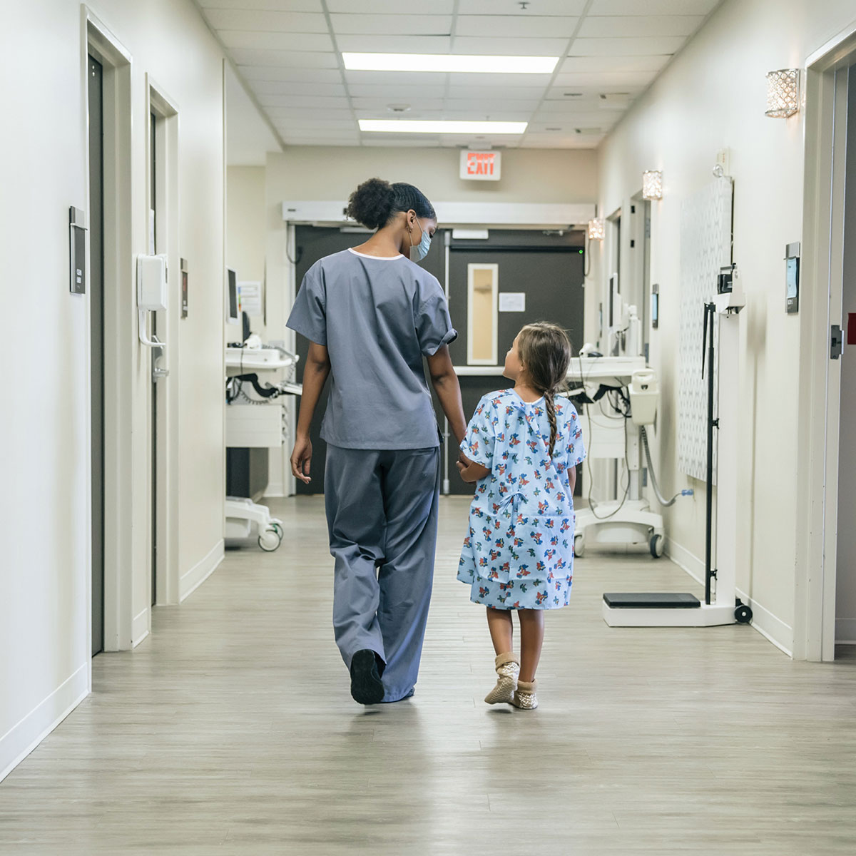 Nurse walking with girl