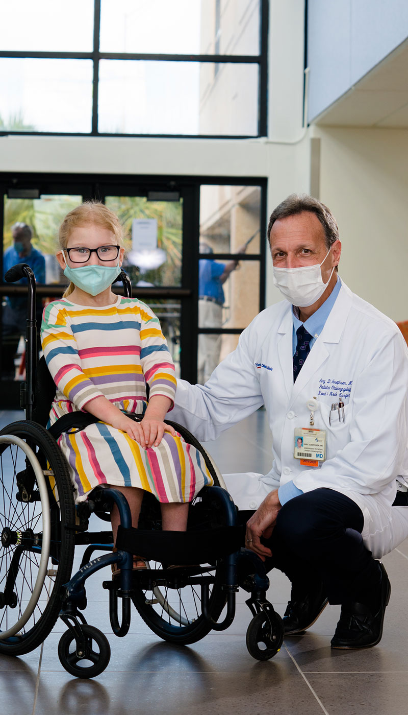 Little girl in wheelchair smiling